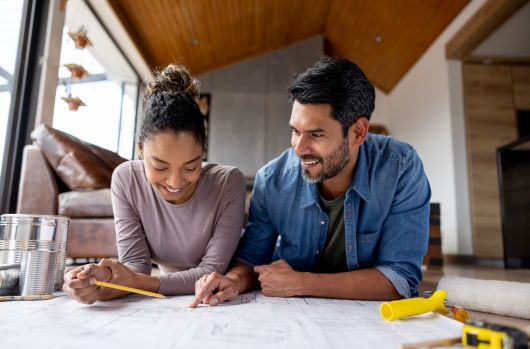 Man and woman looking at plans